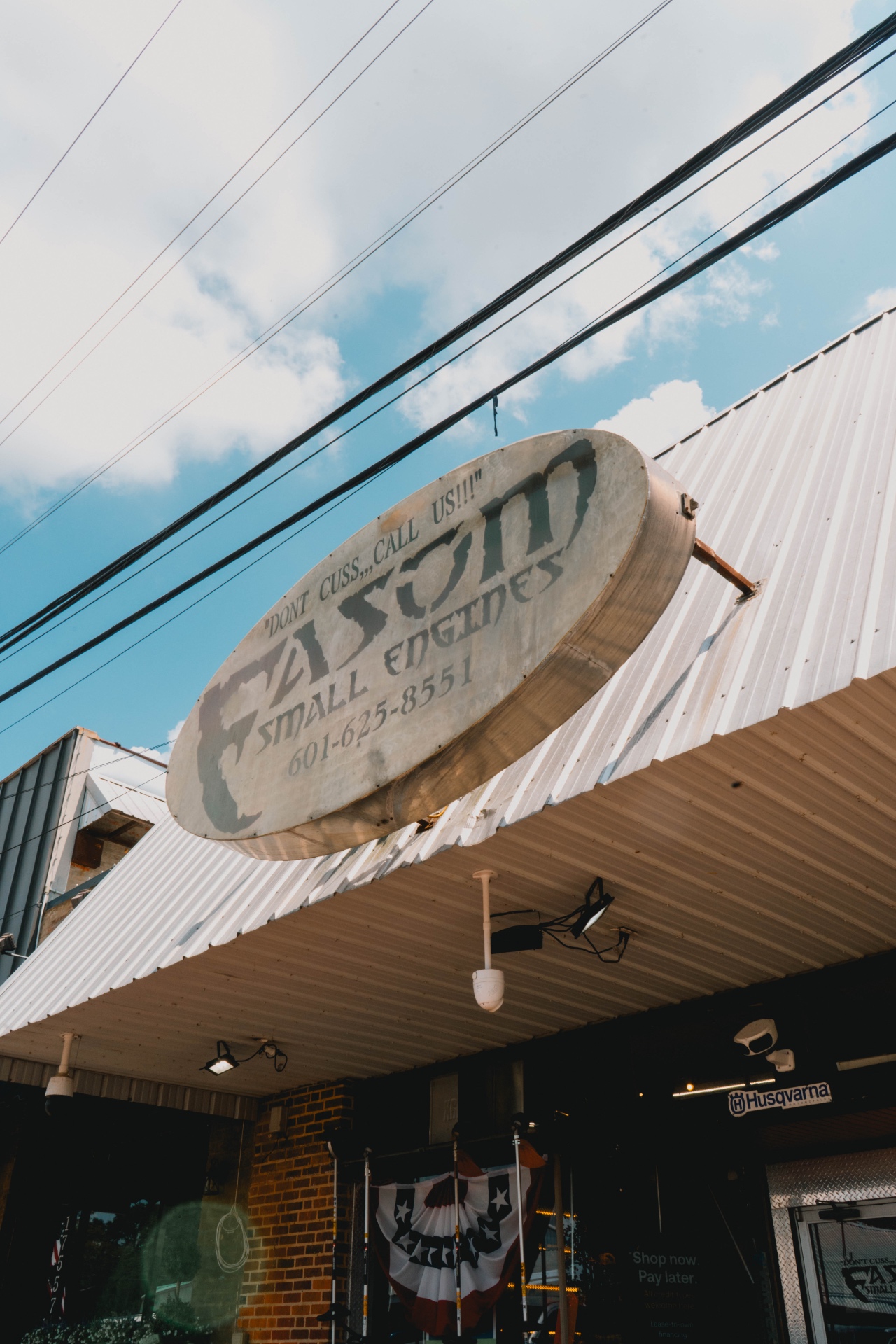 Easom Small Engines shop sign — Don't cuss, call us!!!